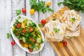 Mexican Quesadilla wrap with chicken, corn and sweet pepper and fresh salad.