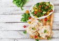 Mexican Quesadilla wrap with chicken, corn and sweet pepper and fresh salad. Royalty Free Stock Photo
