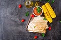 Mexican Quesadilla wrap with chicken, corn and sweet pepper and tomato sauce. Royalty Free Stock Photo