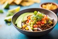 mexican quinoa bowl with spicy salsa and cheese