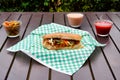 Mexican roast beef torta and souces on wooden table