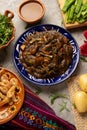 Mexican romeritos with mole sauce and shrimp on a gray background Royalty Free Stock Photo