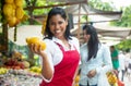 Mexican saleswoman on a farmers market selling fresh fruits Royalty Free Stock Photo