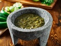 Mexican salsa verde in traditional stone molcajete Royalty Free Stock Photo