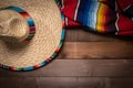 Mexican Serape blanket on wood Background Royalty Free Stock Photo