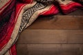 Mexican Serape blanket on wood Background Royalty Free Stock Photo