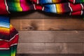 Mexican Serape blanket on wood Background Royalty Free Stock Photo