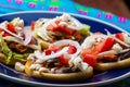 Mexican sopes with chicken tinga and black beans