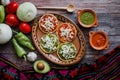 Mexican sopes with grated cheese and salsa, Traditional breakfast in Mexico