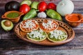 Mexican sopes with grated cheese and salsa, Traditional breakfast in Mexico