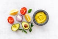 Mexican spicy guacamole avocado dip in mortar with ingredients Royalty Free Stock Photo