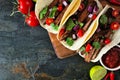 Mexican steak tacos, top down close up on a dark background