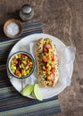 Mexican street style hot dog on wooden background Royalty Free Stock Photo