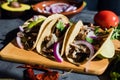Mexican street tacos with lemon, sauce, onion and cilantro in Mexico city Royalty Free Stock Photo