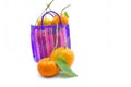 Mexican style bag for the errand or to go to the market, with tangerines inside on a white backgroundMexican style bag for the