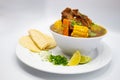 Mexican caldo de res on a white background