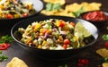 Mexican style salad of black beans, lentils, corn, tomato and lettuce with a salsa and tortilla chips Royalty Free Stock Photo