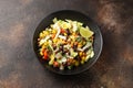 Mexican style salad of black beans, lentils, corn, tomato and lettuce with a salsa and tortilla chips Royalty Free Stock Photo