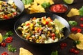 Mexican style salad of black beans, lentils, corn, tomato and lettuce with a salsa and tortilla chips Royalty Free Stock Photo