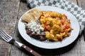 Mexican style scrambled eggs with fried beans, cheese and jalapeno