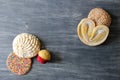 Mexican sweet bread on vintage gray table. Shell, cupcake, bow tie, ear, biscuit with multicolored twigs