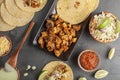 Mexican taco dish with corn tortillas, precooked, preseasoned chicken pieces