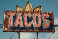 A mexican taco illuminated sign above a street food vendor truck. Royalty Free Stock Photo