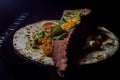 Mexican taco made with brisket, guacamole and vinaigrette