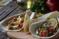 Mexican tacoes with pepper, corn and cucumbes