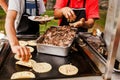 Mexican taquero making tacos al pastor in Taqueria in Mexico Royalty Free Stock Photo