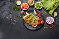 Mexican tacos with beef, tomatoes, avocado, onion and salsa sauce Royalty Free Stock Photo