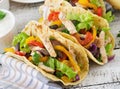 Mexican tacos with chicken, black beans and fresh vegetables Royalty Free Stock Photo