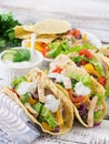 Mexican tacos with chicken, black beans and fresh vegetables and tartar sauce Royalty Free Stock Photo