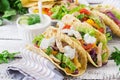 Mexican tacos with chicken, black beans and fresh vegetables and tartar sauce Royalty Free Stock Photo