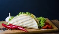 Mexican tacos with chicken meat, salad and vegetables sauce presented on a wooden board with a chilly pepper tomato and Royalty Free Stock Photo