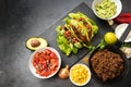 Mexican tacos and ingredients like fried ground beef, tomato sal