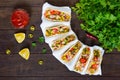 Mexican tacos with meat, corn, tomatoes, sweet pepper, red onions in a wheat tortilla Royalty Free Stock Photo