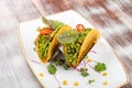 Mexican tacos. With pork, pepper and guacomole. Mexican traditional dish