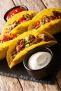 Mexican tacos stuffed with minced beef and vegetables close-up. vertical Royalty Free Stock Photo