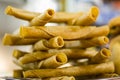 Mexican taquitos on display at a market