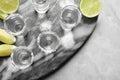 Mexican Tequila shots, lime slices and salt on marble table, top view Royalty Free Stock Photo