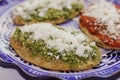 Mexican tlacoyos with green and red sauce, Traditional food in Mexico Royalty Free Stock Photo