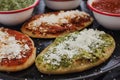 Mexican tlacoyos with green and red sauce, Traditional food in Mexico Royalty Free Stock Photo