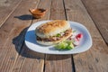 Mexican torta of roast beef with radish lemons and sauce mexican burger