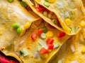 mexican tortillas with guacamole, corn and cheese