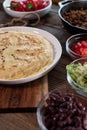 Mexican tortillas with meat and vegetables on a wooden table Royalty Free Stock Photo