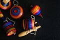 Mexican toys from Wooden, balero, yoyo and trompo in Mexico on black background Royalty Free Stock Photo