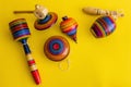 Mexican toys from Wooden, balero, yoyo and trompo in Mexico on a yellow background Royalty Free Stock Photo