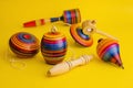 Mexican toys from Wooden, balero, yoyo and trompo in Mexico on a yellow background Royalty Free Stock Photo