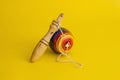 Mexican toys from Wooden, balero, yoyo and trompo in Mexico on a yellow background Royalty Free Stock Photo